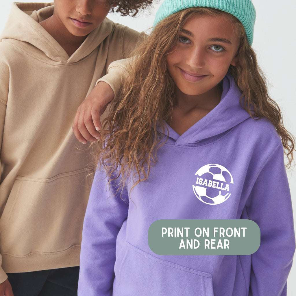 two young girls wearing purple sweatshirts and hats